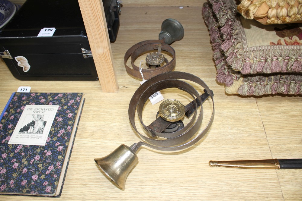 Two antique wrought iron and brass shop bells, height 33cm and 24cm